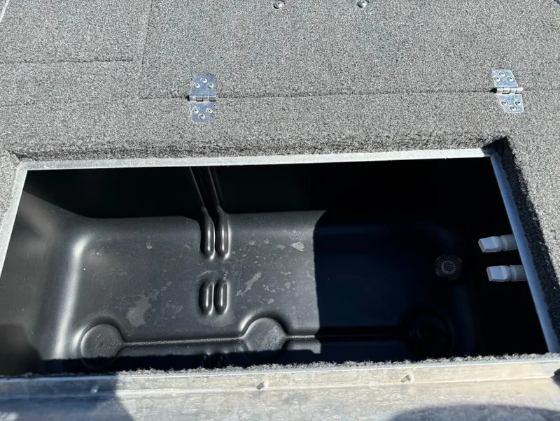 Slide: The Image of 2022 Lowe Fishing Machine 1675 WT storage compartment with open lid, showing interior details. - 10