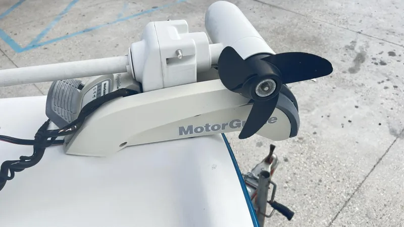 Slide: The Image of Trolling motor on a Fishmaster 1900 boat, 2002 model, on a concrete surface. - 12