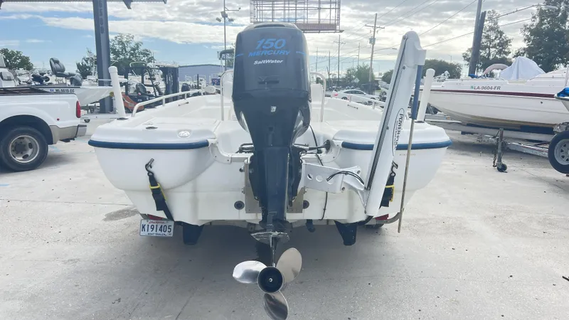 Slide: The Image of 2002 Fishmaster 1900 boat with Mercury 150 Saltwater engine, parked in a marina. - 8