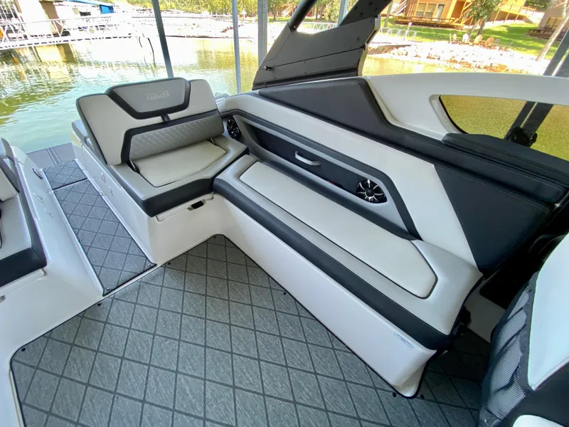 Slide: The Image of 2019 Yamaha Boats 275 SE interior with sleek seating and modern design. - 17