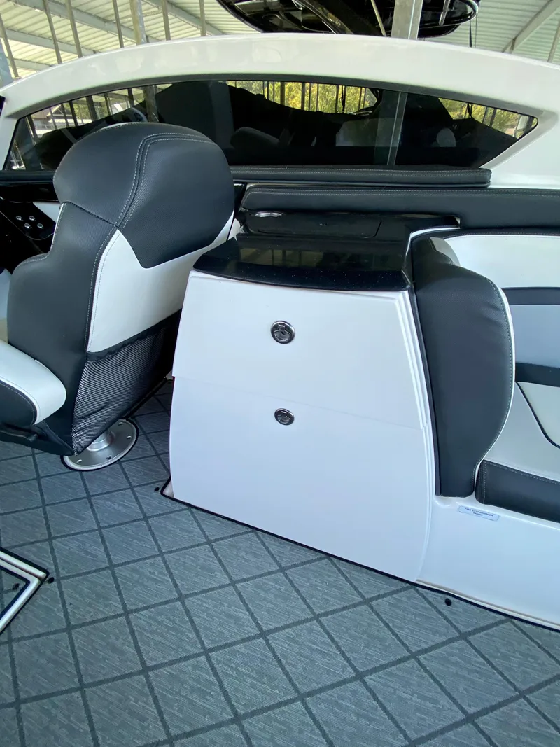 Slide: The Image of 2019 Yamaha Boats 275 SE interior with sleek seating and modern design. - 21