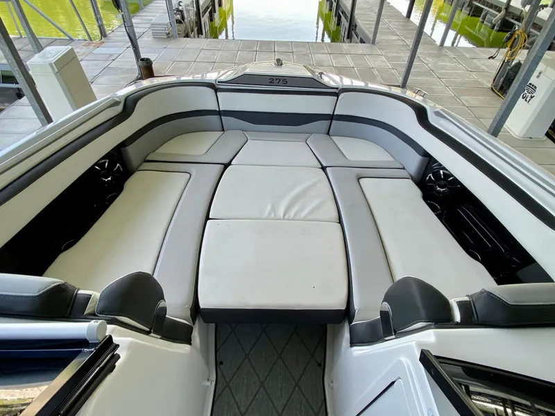 Slide: The Image of 2019 Yamaha Boats 275 SE interior with spacious seating and modern design. - 35