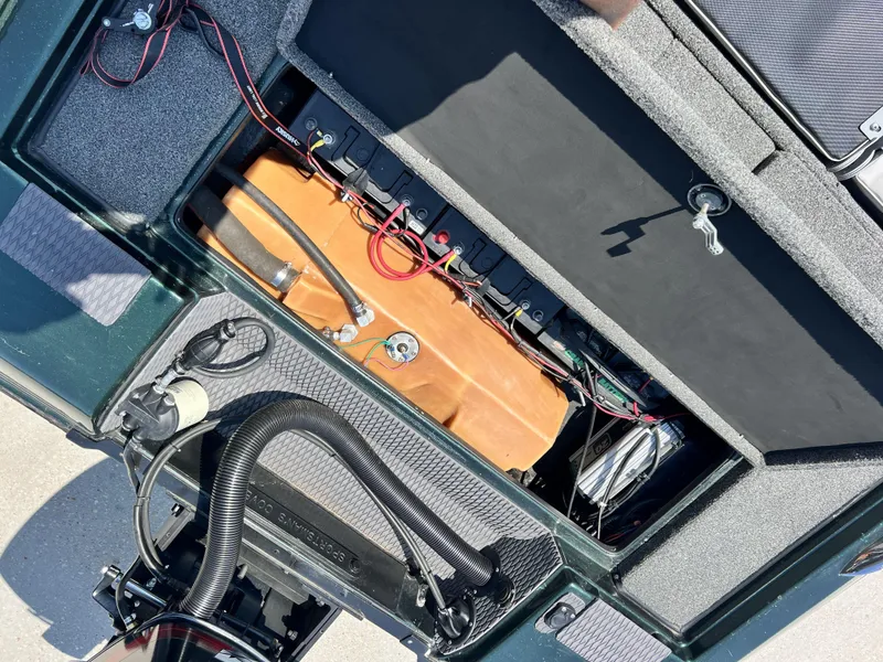 Slide: The Image of 1994 Skeeter 140 SLS boat interior showing wiring and components. - 14