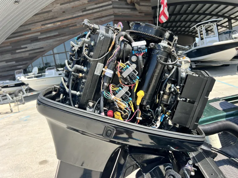 Slide: The Image of Close-up of a 1994 Skeeter 140 SLS boat engine with exposed wiring and components. - 20