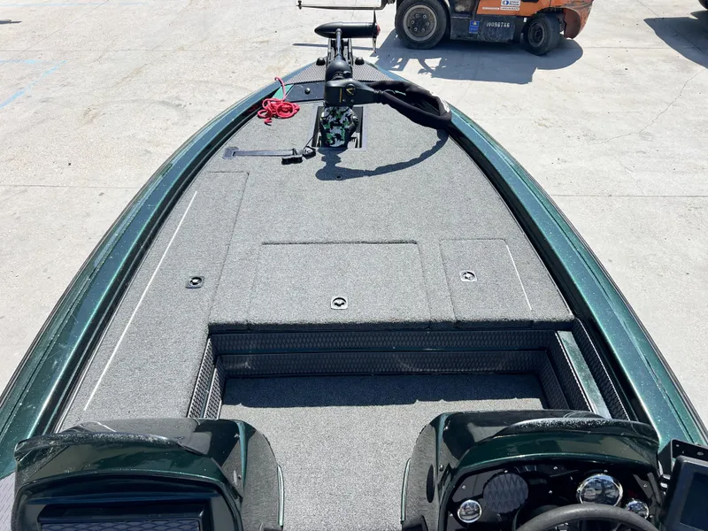 Slide: The Image of 1994 Skeeter 140 SLS boat deck with steering wheel and storage compartments. - 21