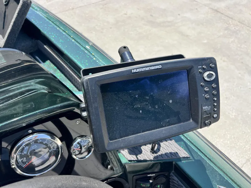 Slide: The Image of Humminbird fish finder on 1994 Skeeter 140 SLS boat dashboard. - 24