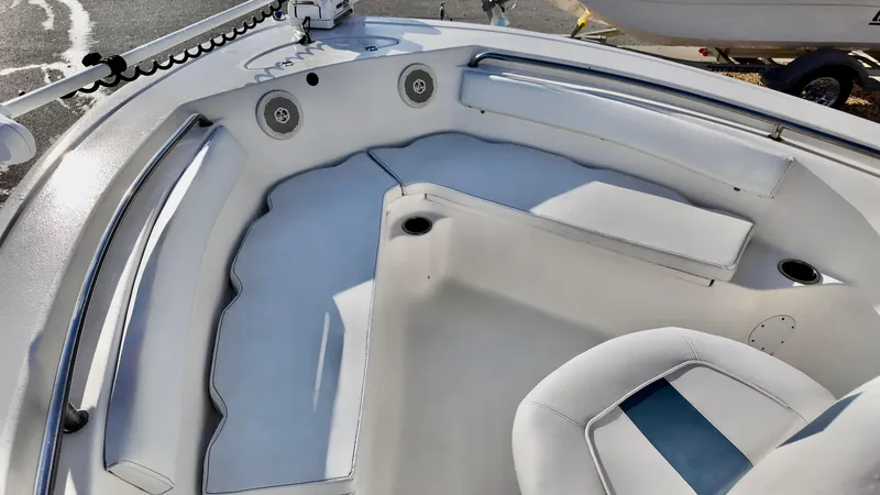 Slide: The Image of 2014 Tidewater 210 LXF boat interior with cushioned seating and cup holders. - 7