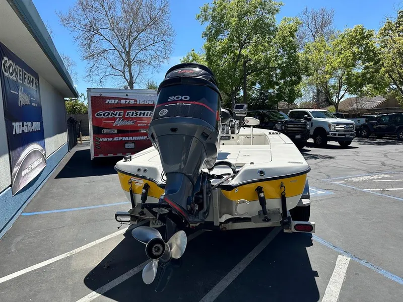 Slide: The Image of 2007 Ranger 191 Cayman boat with outboard motor in parking lot. - 10