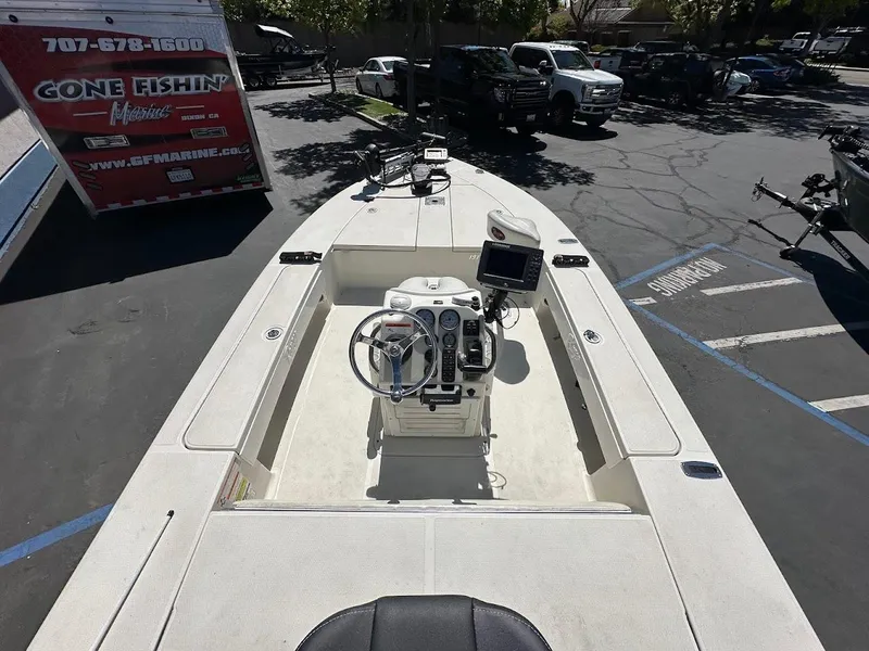 Slide: The Image of 2007 Ranger 191 Cayman boat with steering console, parked in a lot. - 14