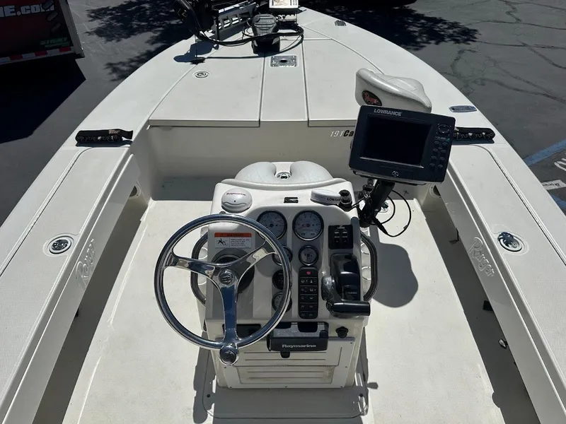 Slide: The Image of 2007 Ranger 191 Cayman boat dashboard with steering wheel and navigation system. - 15