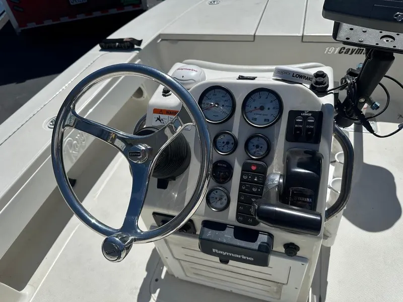 Slide: The Image of Control panel of a 2007 Ranger 191 Cayman boat with steering wheel and gauges. - 16