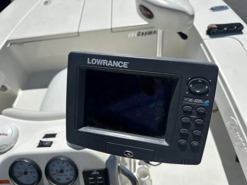 Slide: The Image of Lowrance fishfinder on 2007 Ranger 191 Cayman boat dashboard, featuring control buttons and display screen. - 17