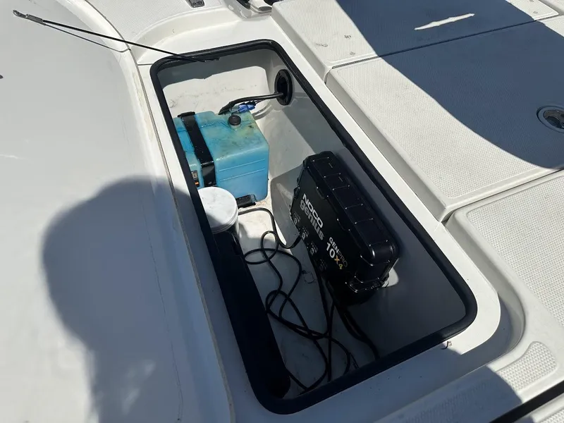 Slide: The Image of Storage compartment of 2007 Ranger 191 Cayman boat with battery and equipment. - 29
