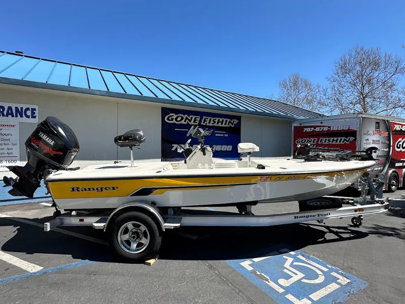 Slide: The Image of 2007 Ranger 191 Cayman boat on trailer, parked outside a fishing store. - 3