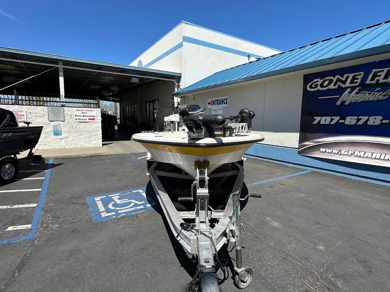 Slide: The Image of 2007 Ranger 191 Cayman boat parked outside a marine dealership on a sunny day. - 5