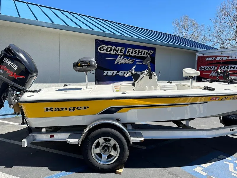 Slide: The Image of 2007 Ranger 191 Cayman boat with Yamaha engine, parked outside a fishing store. - 8