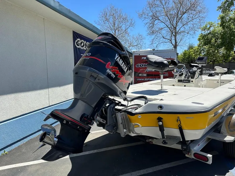 Slide: The Image of 2007 Ranger 191 Cayman boat with Yamaha outboard motor, parked outdoors. - 9