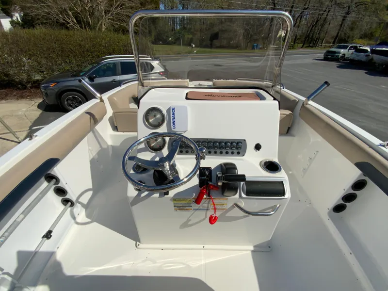 Slide: The Image of 2016 Hurricane Center Console 19 OB boat interior with steering wheel and control panel. - 10