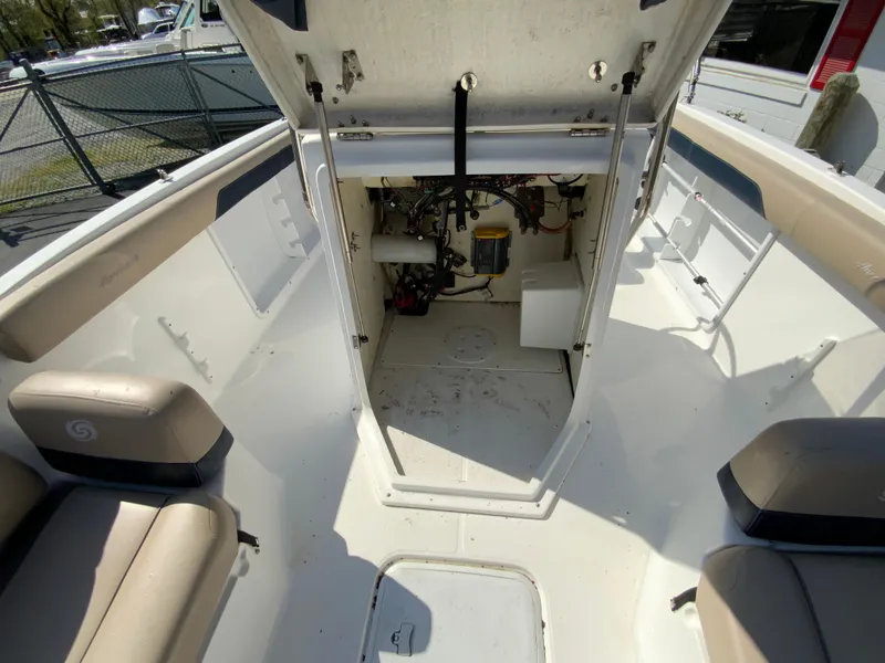 Slide: The Image of 2016 Hurricane Center Console 19 OB boat interior with open storage compartment. - 15