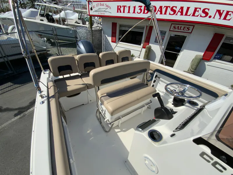 Slide: The Image of 2016 Hurricane Center Console 19 OB boat interior with seating and steering wheel. - 16