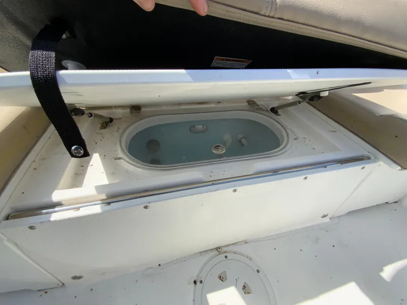 Slide: The Image of 2016 Hurricane Center Console 19 OB boat's open storage compartment with visible interior. - 18
