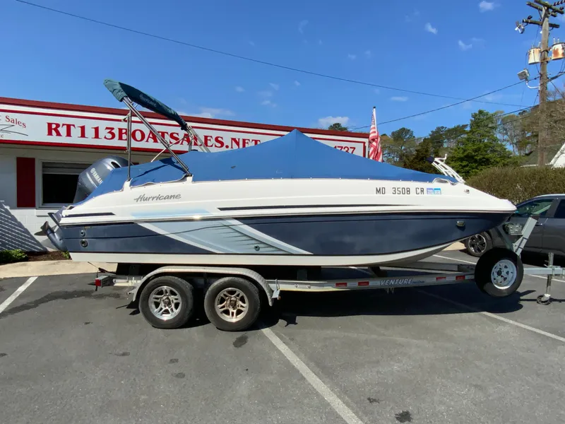 Slide: The Image of 2016 Hurricane Center Console 19 OB boat on trailer at dealership. - 19