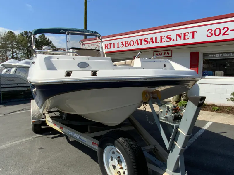 Slide: The Image of 2016 Hurricane Center Console 19 OB boat on trailer at dealership. - 3