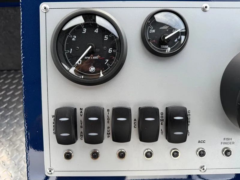 Slide: The Image of Control panel of 2025 Thunder Jet 185 Luxor boat with gauges and switches. - 11