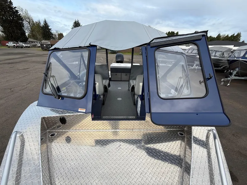 Slide: The Image of 2025 Thunder Jet 185 Luxor boat with open cabin doors and aluminum deck. - 16