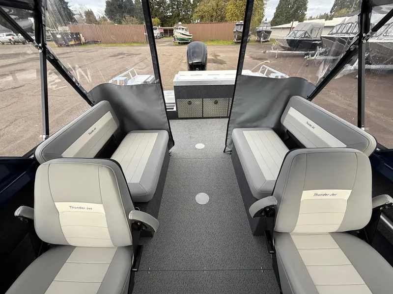 Slide: The Image of 2025 Thunder Jet 185 Luxor interior with gray seating and spacious layout. - 17