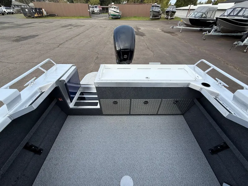 Slide: The Image of 2025 Thunder Jet 185 Luxor boat interior with storage compartments and outboard motor. - 18