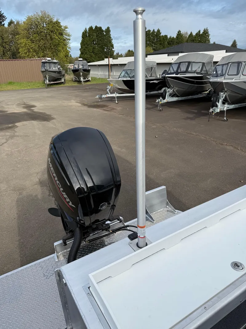 Slide: The Image of 2025 Thunder Jet 185 Luxor boat with outboard motor in a dealership lot. - 20