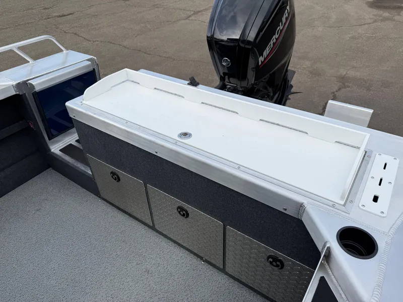 Slide: The Image of 2025 Thunder Jet 185 Luxor boat interior with Mercury engine, storage compartments, and seating area. - 22