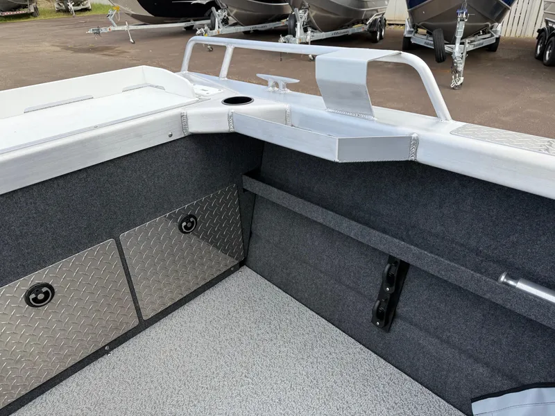 Slide: The Image of 2025 Thunder Jet 185 Luxor boat interior with storage compartments and sleek design. - 23