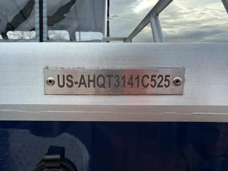 Slide: The Image of 2025 Thunder Jet 185 Luxor boat with identification plate, US-AHQT3141C525, against a cloudy sky. - 24