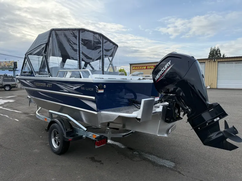 Slide: The Image of 2025 Thunder Jet 185 Luxor boat with Mercury outboard motor on a trailer. - 4