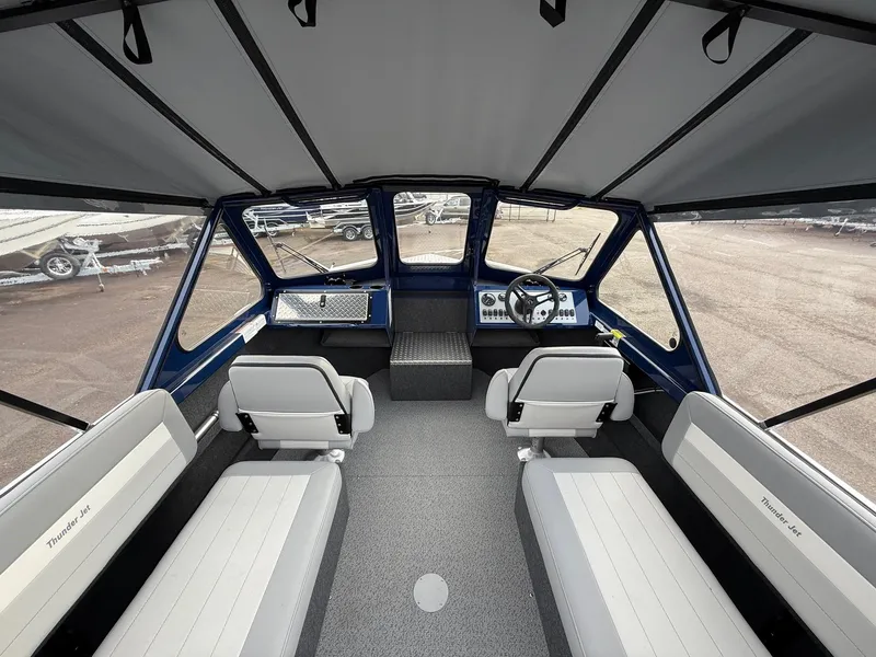 Slide: The Image of 2025 Thunder Jet 185 Luxor boat interior with seating and steering console. - 7