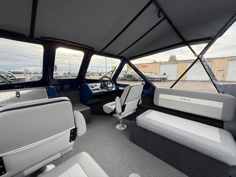 Slide: The Image of Interior of 2025 Thunder Jet 185 Luxor boat with modern seating and dashboard. - 8