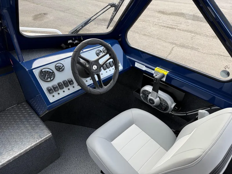 Slide: The Image of 2025 Thunder Jet 185 Luxor boat interior with steering wheel and control panel. - 9
