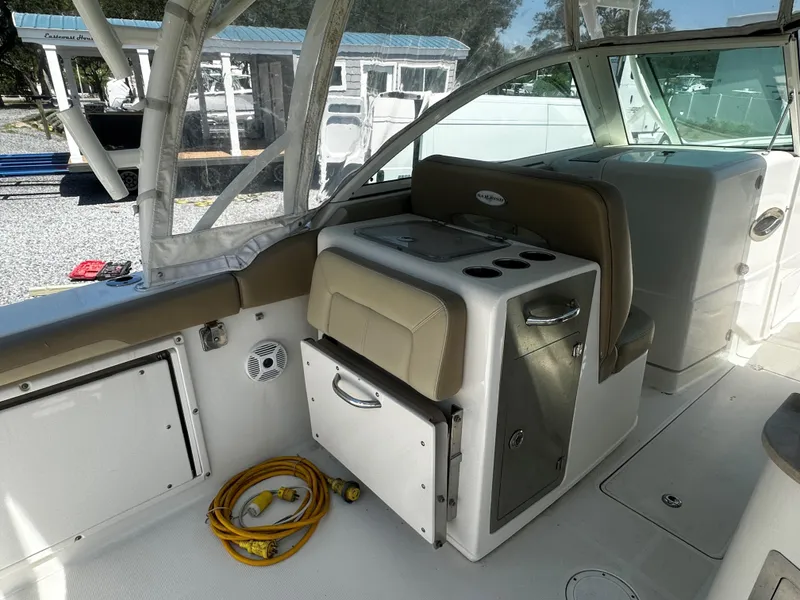 Slide: The Image of 2018 Sailfish 325DC boat interior with seating and storage compartments. - 8