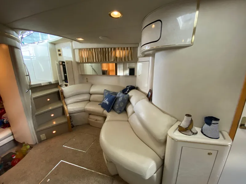 Slide: The Image of Luxurious interior of a 1997 Sea Ray 450 Sundancer yacht with plush seating. - 19