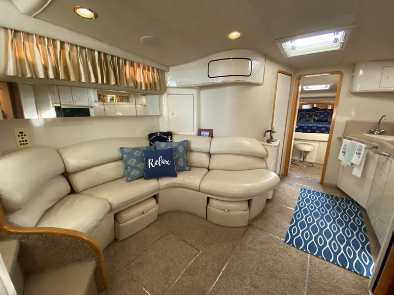 Slide: The Image of Luxurious interior of a 1997 Sea Ray 450 Sundancer yacht with plush seating and modern amenities. - 20