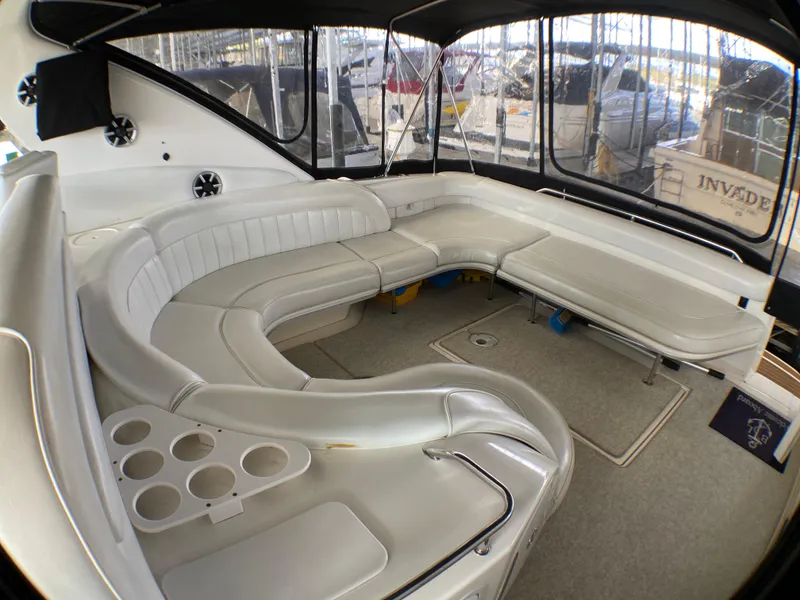 Slide: The Image of Luxurious interior of a 1997 Sea Ray 450 Sundancer yacht with white leather seating. - 5