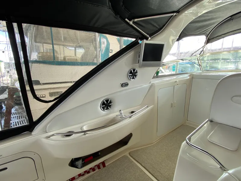 Slide: The Image of Interior of 1997 Sea Ray 450 Sundancer yacht, featuring seating and entertainment area. - 6