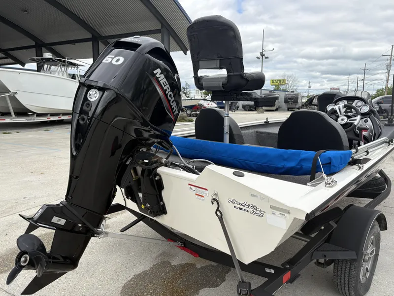 Slide: The Image of 2021 Tracker Pro Team 175 Tournament boat with Mercury 50 engine, parked outdoors. - 3