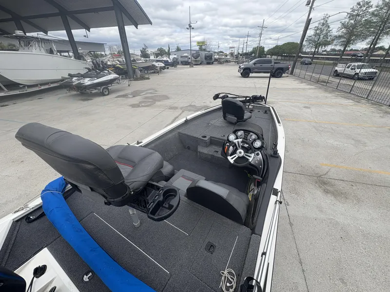 Slide: The Image of 2021 Tracker Pro Team 175 Tournament boat interior with steering console and seating. - 8
