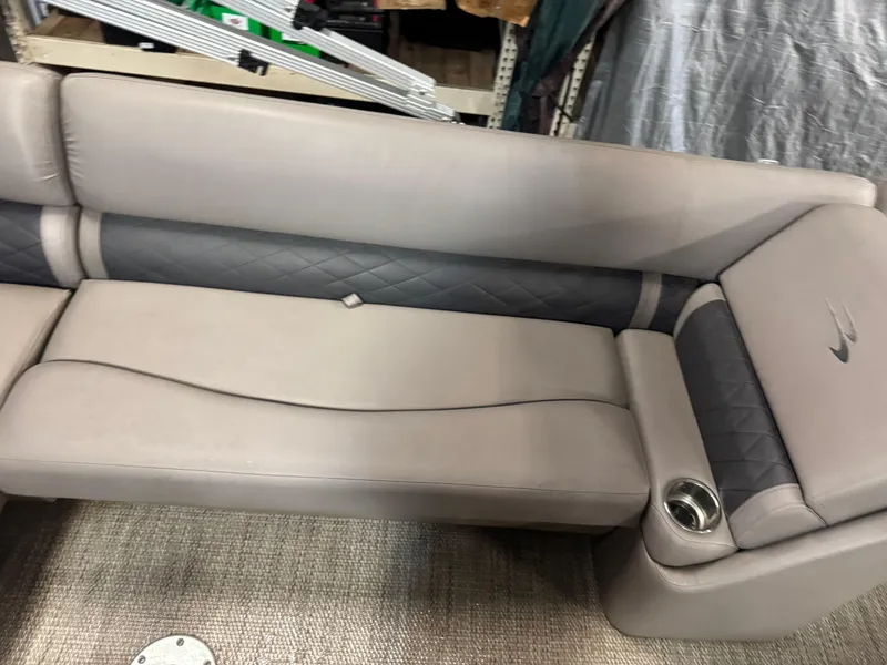 Slide: The Image of 2018 Bennington 25 SSXAPG boat seat with gray upholstery and cup holder. - 13