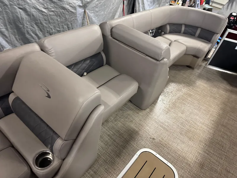 Slide: The Image of Luxurious seating on 2018 Bennington 25 SSXAPG pontoon boat, featuring plush upholstery and cup holders. - 14