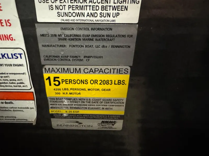 Slide: The Image of 2018 Bennington 25 SSXAPG capacity label: 15 persons or 2083 lbs, 300 HP motor. - 5