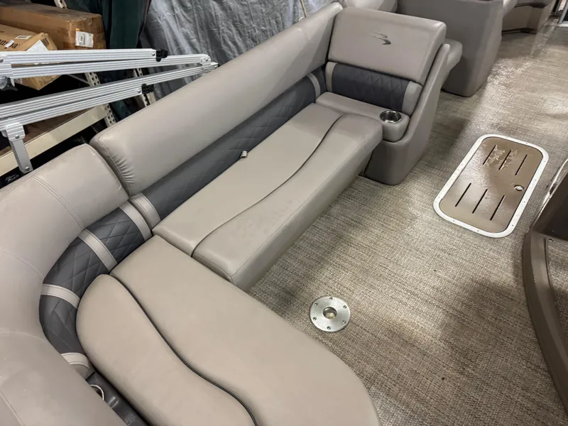 Slide: The Image of 2018 Bennington 25 SSXAPG pontoon boat interior with beige seating and cup holder. - 8